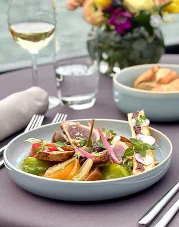 Savour a gourmet lunch with wine onboard