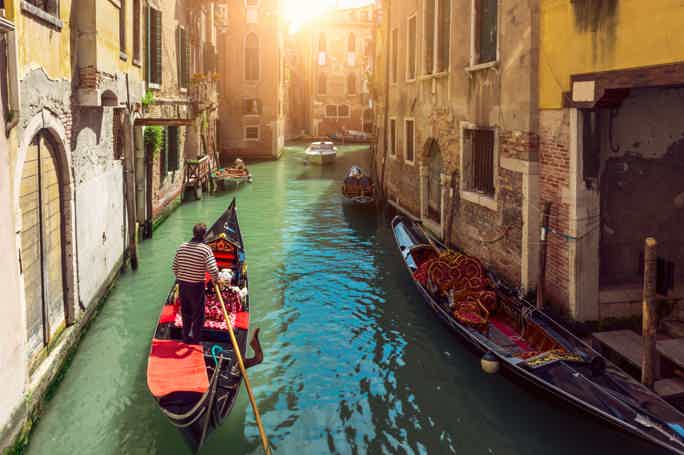Traditional Shared Gondola Ride across small canals to Grand Canal